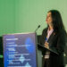 Soledad Tapia, directora nacional de Sernapesca, exponiendo sobre la gestión del cumplimiento en el centro de convenciones de Deloitte Santiago.