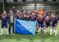 Delegaciones de empresas salmoneras durante el desfile inaugural del Campeonato de Fútbol 7 NACHIPA Wellboats en Puerto Montt.
