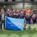 Delegaciones de empresas salmoneras durante el desfile inaugural del Campeonato de Fútbol 7 NACHIPA Wellboats en Puerto Montt.